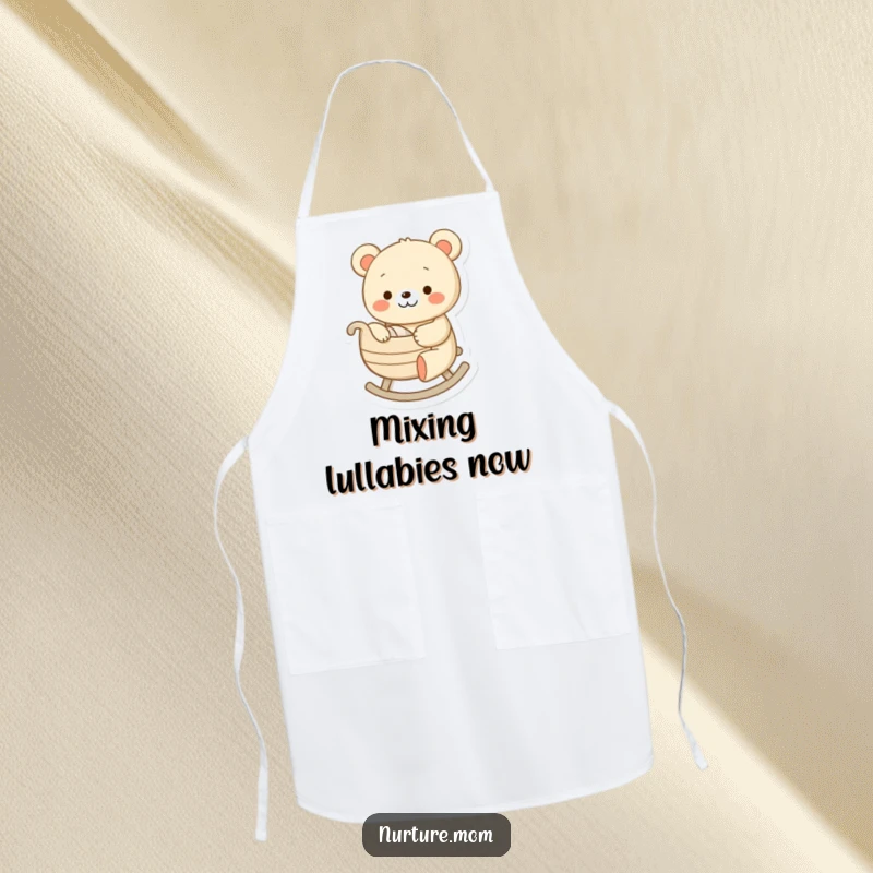 Funny apron showing a cheerful bear character gently rocking a tiny cradle, a humorous and practical accessory for parents.