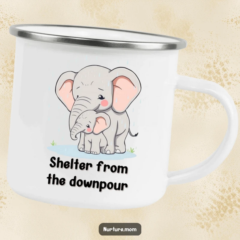 Camping mug showing a mother elephant protectively shielding her calf from the rain in an outdoor setting.
