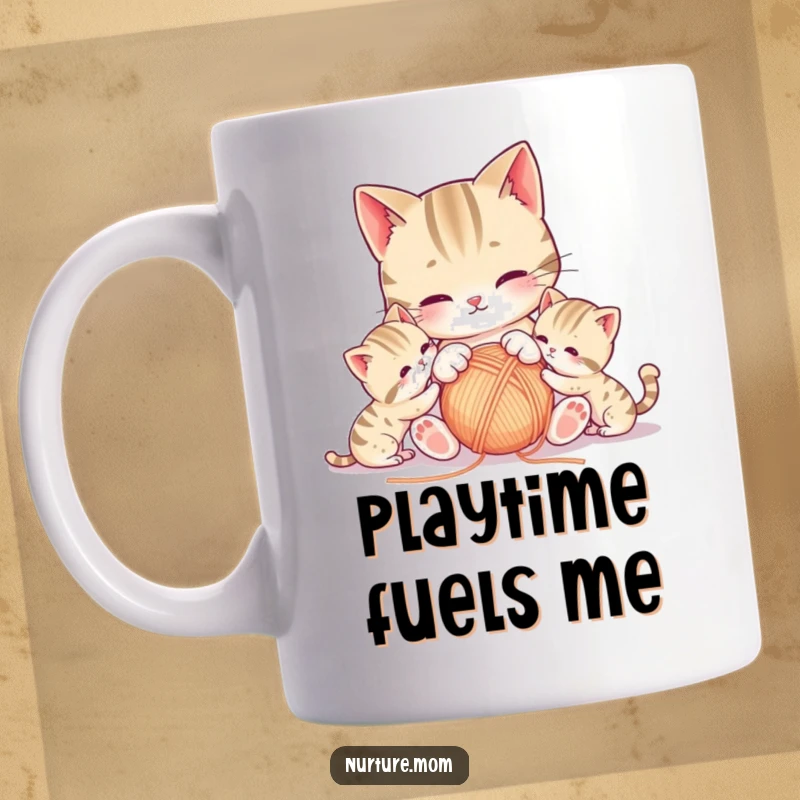 Funny kawaii mother cat playfully swatting a yarn ball with her curious kittens on a mug.