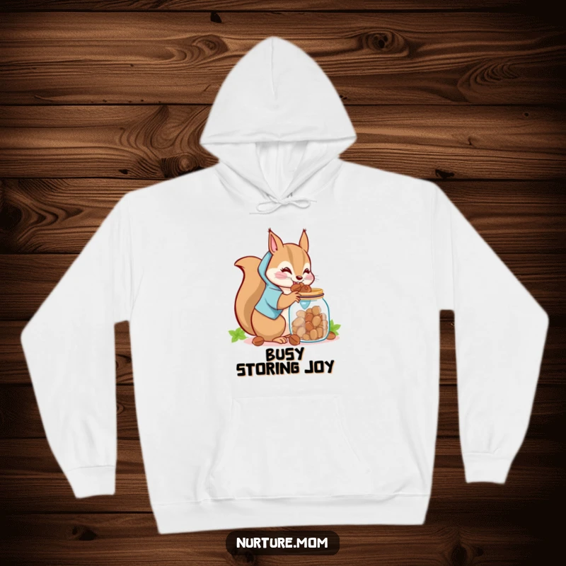 Funny Kawaii Squirrel Mom Hoodie: A cute squirrel mom storing nuts in a jar, cozy and humorous winter wear.
