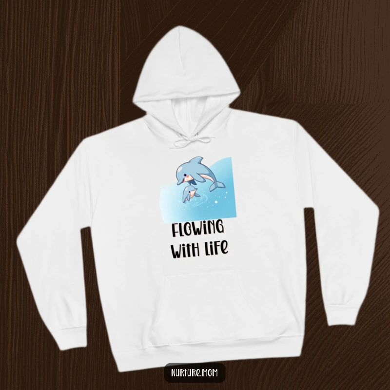 Funny hoodie showcasing a playful dolphin mom guiding her calf through sparkling water, symbolizing protection, guidance, and aquatic joy.