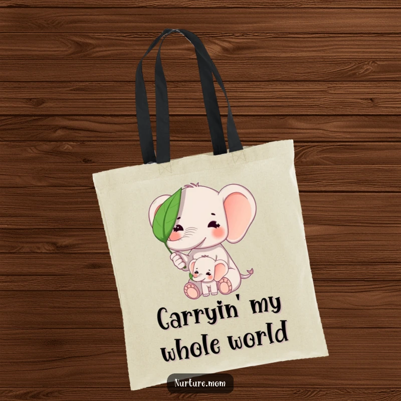 Funny kawaii elephant mom shielding baby elephant from sun with a leaf on a durable canvas tote bag.