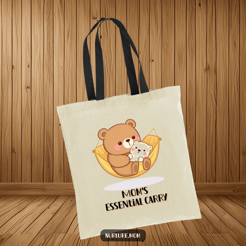 Funny kawaii bear mom rocking a baby animal in a cozy hammock, featured on a practical and heartwarming tote bag.